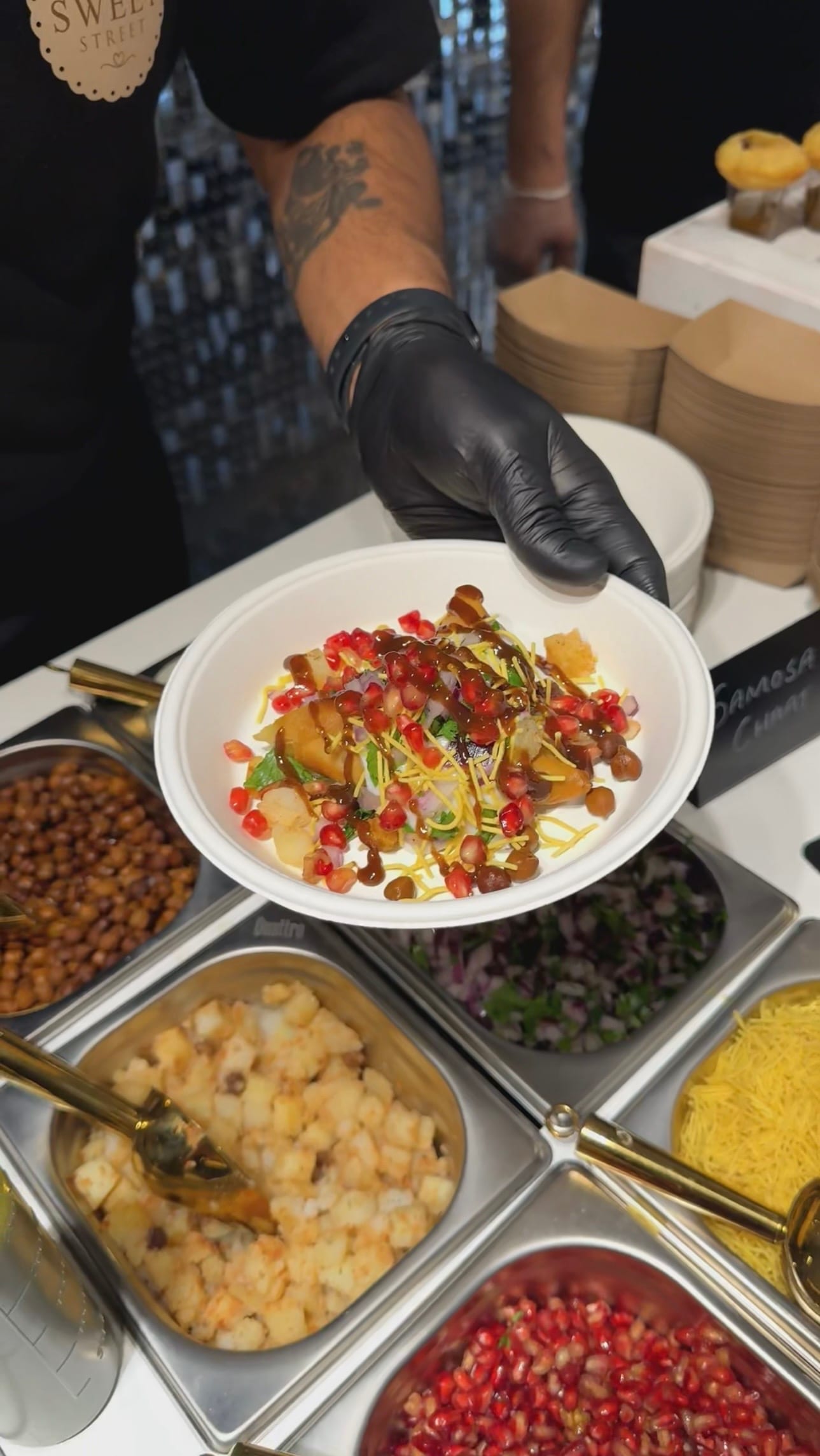 Freshly made samosa chaat served at a Sweet St. event