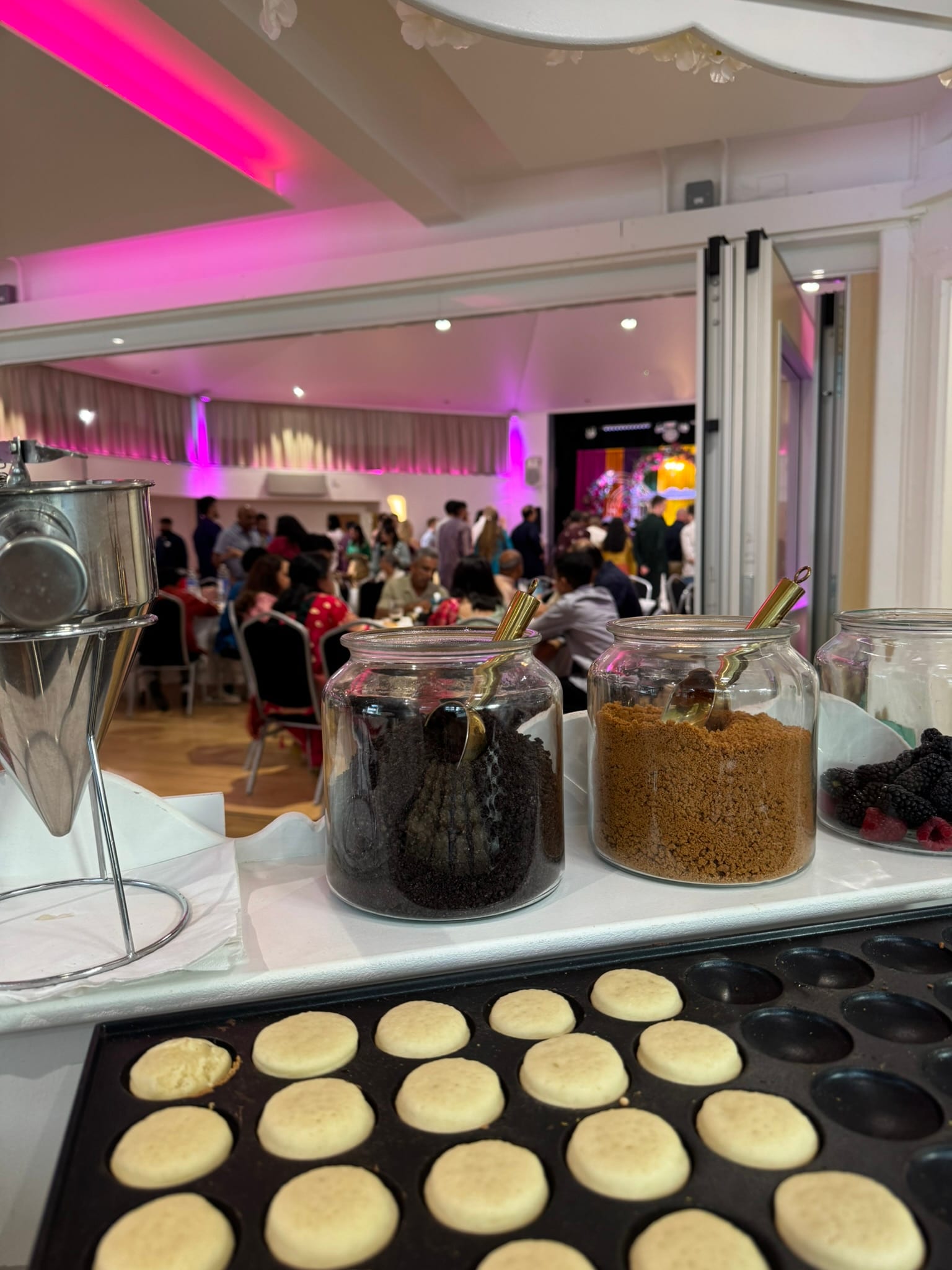 Mini pancakes and toppings at an event